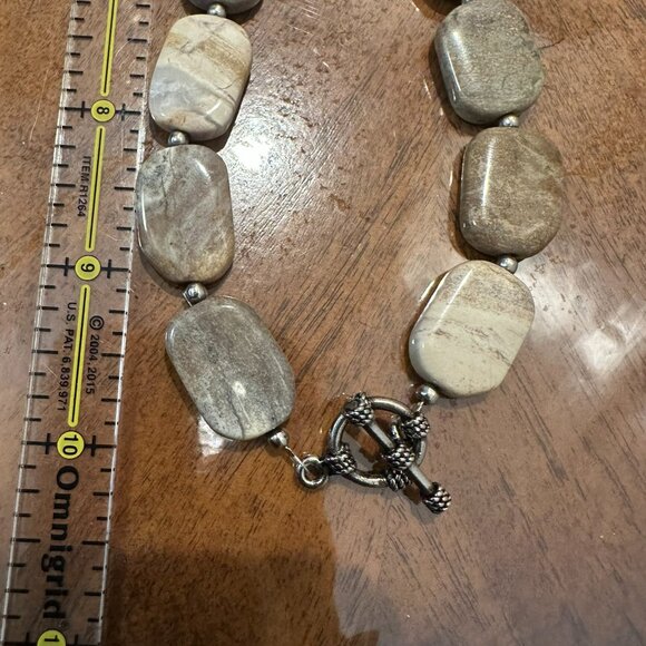 This necklace is a chunky, natural stone necklace with a carved flower pendant - Picture 7 of 10